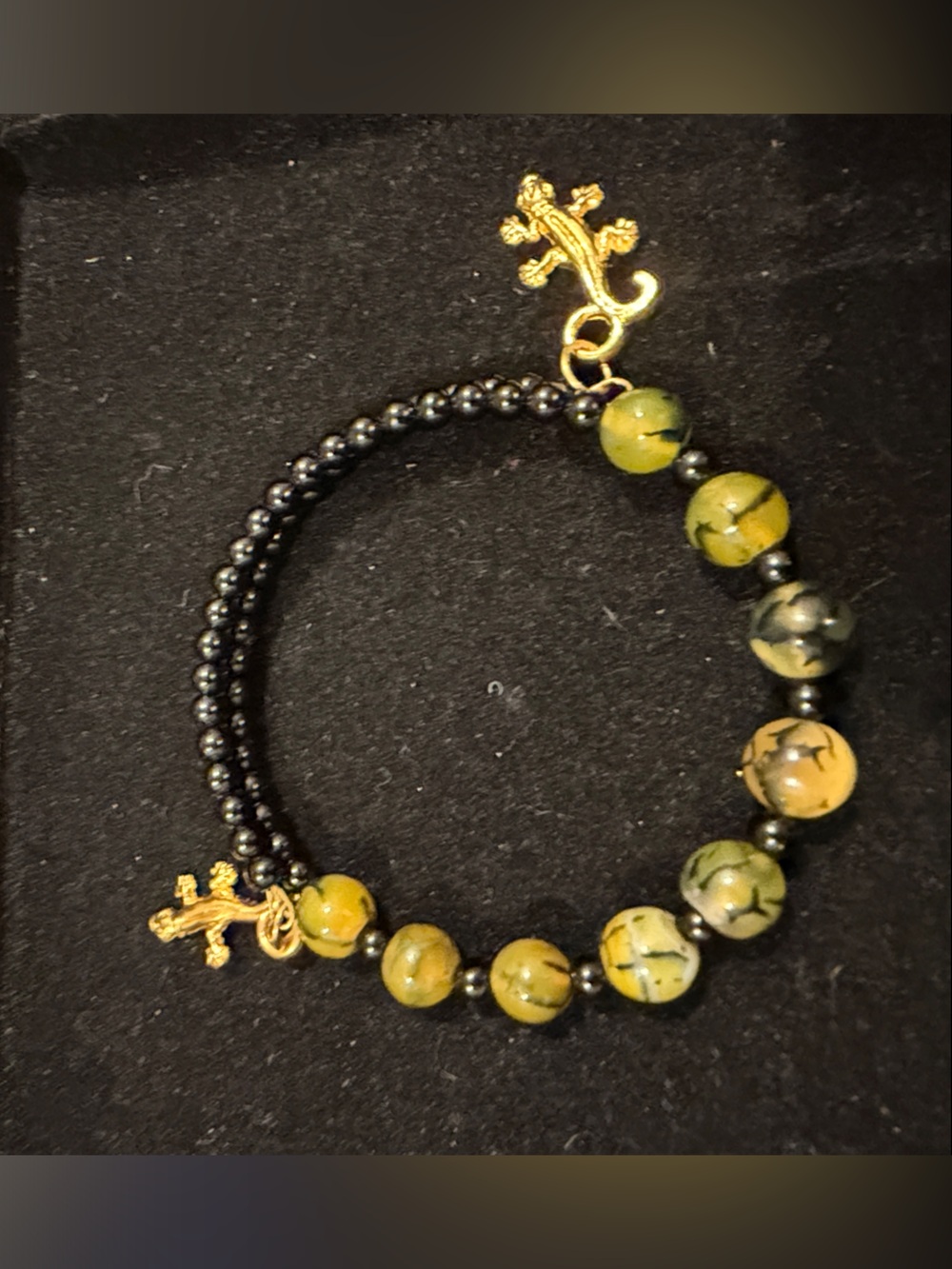 Gold Cross Accent Black and Olive Bead Stretch Bracelet